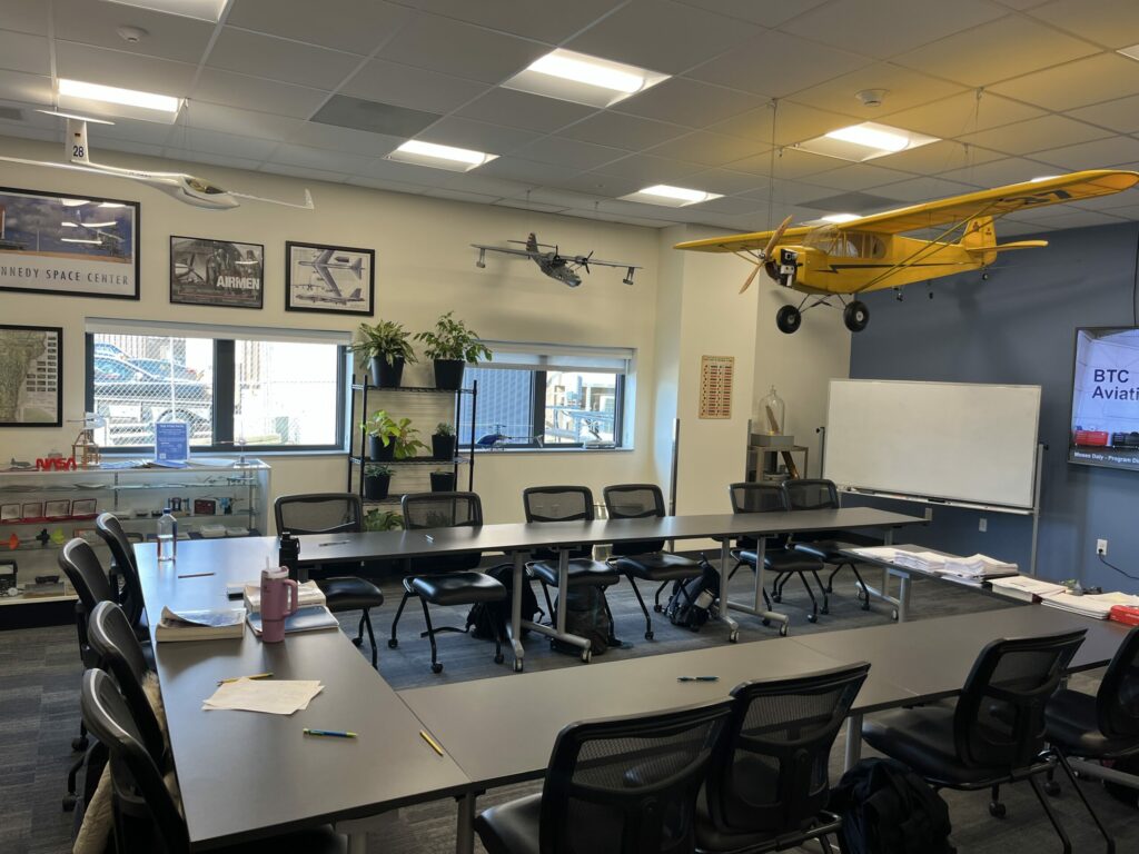new classroom with model airplanes hanging 