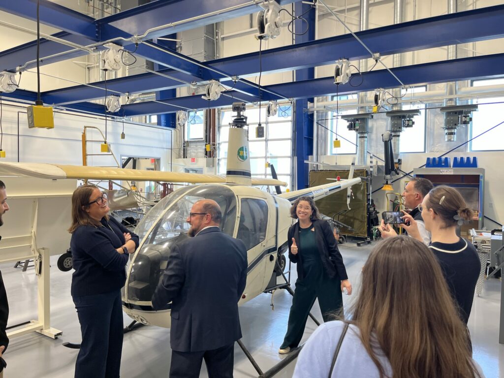 posing with a helicopter